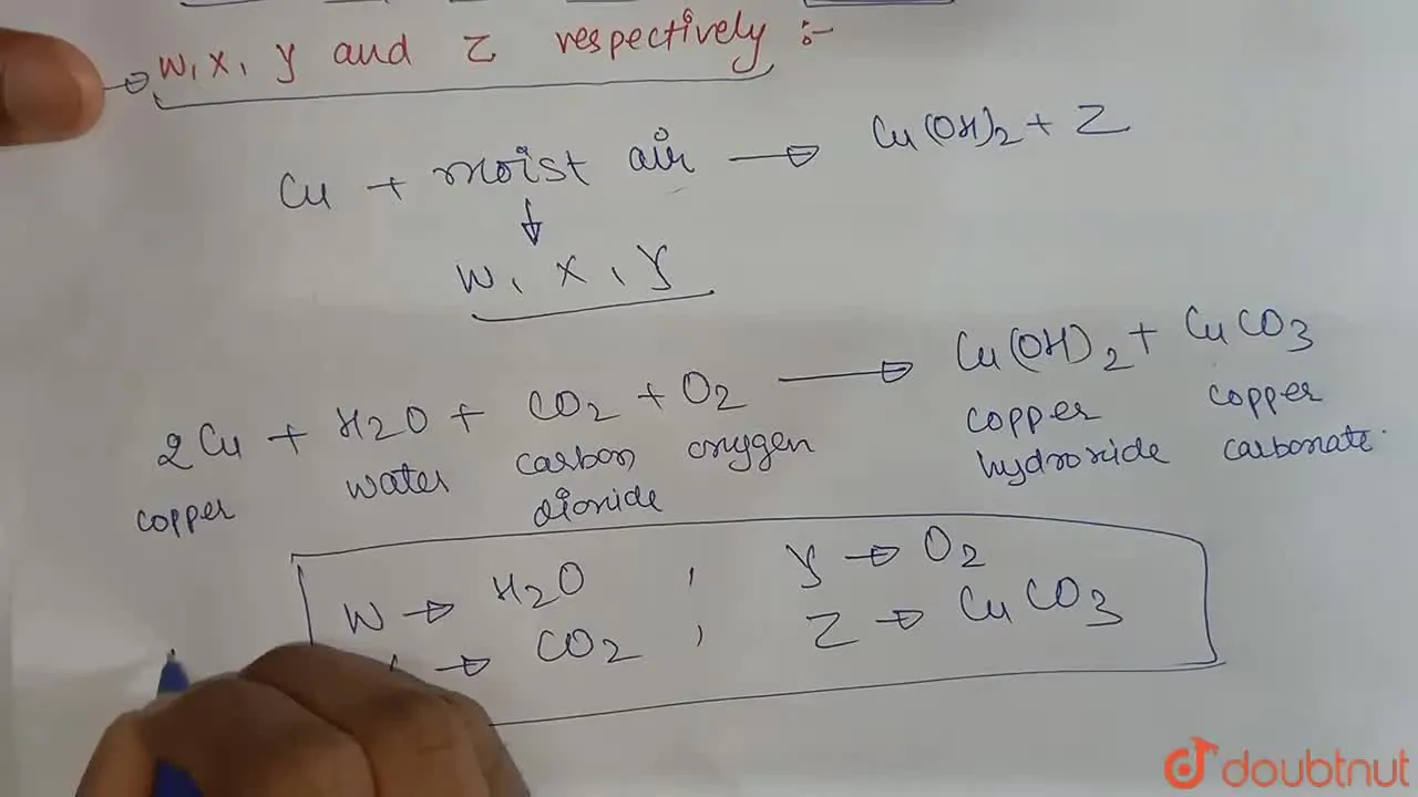 When a copper vessel is exposed to moist air for long, it acquires a d